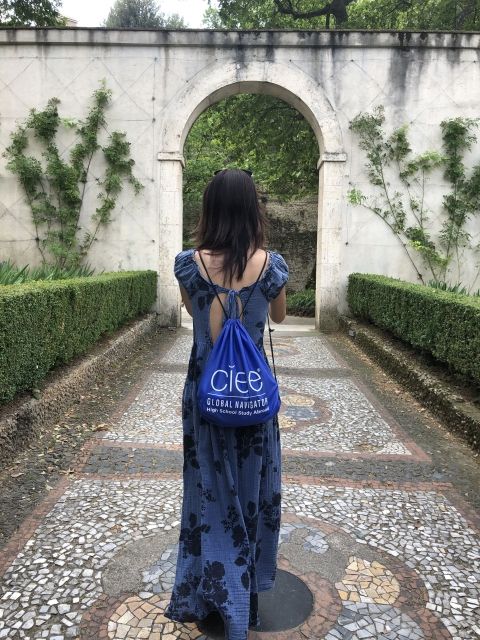 High school student abroad wearing CIEE bag