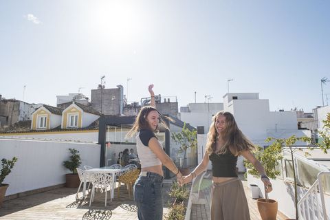 Students smiling while dancing together