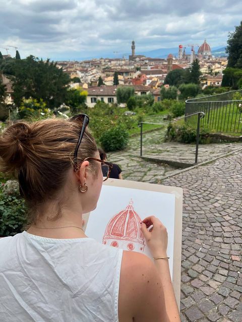 Student drawing building in Italy