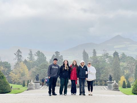 High school students in Ireland posing in front of estate
