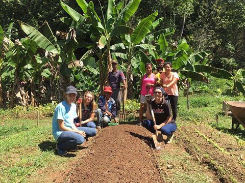 students gardening with locals in Santiago