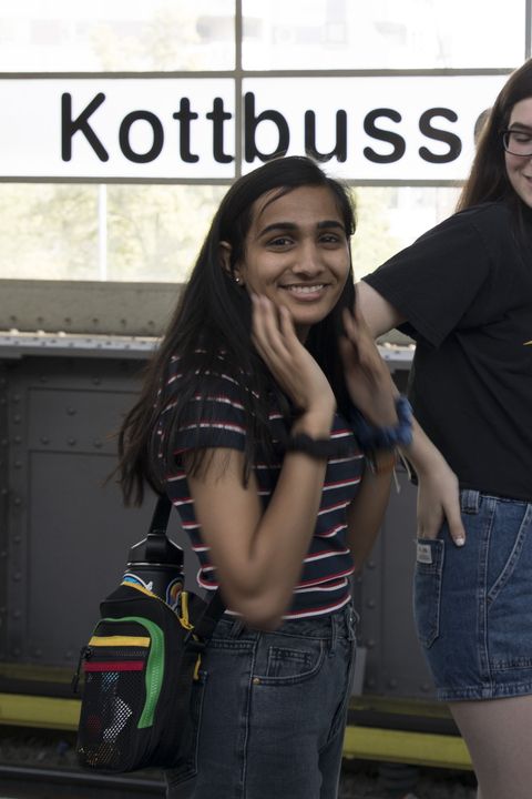 High school girl smiling on the subway in Berlin