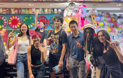 High school summer students having fun in Asian store abroad