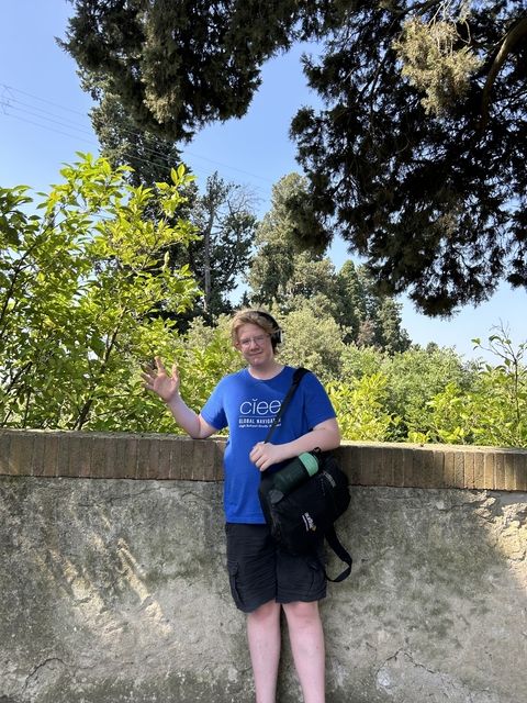 Student waving from the Boboli Gardens in Florence, Italy