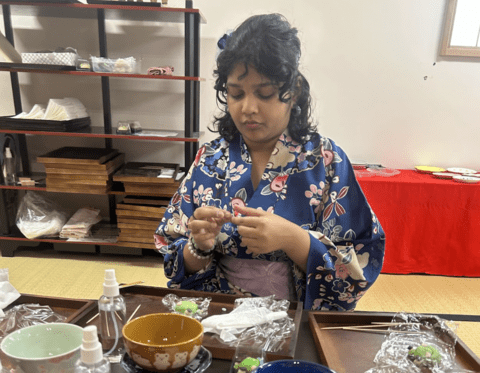 a single student working to make her wagashi frog