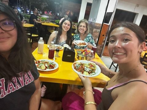 students getting food with their host mom