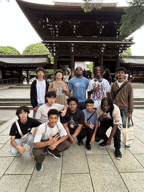posing in front of japanese shrine