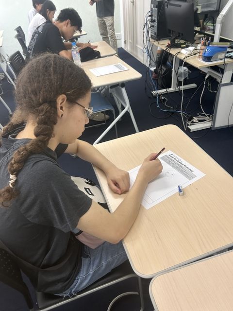 student drawing manga in class