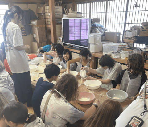 students making hoto noodles under the supervision of noodle experts