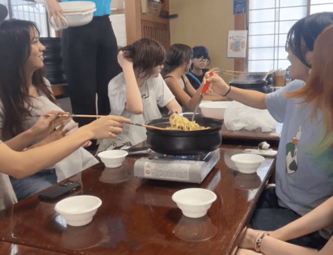 students eating hoto noodles after making them