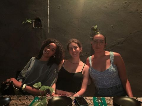 Three high school students eating out together