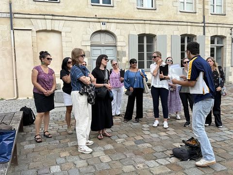 Teachers conversing during excursion in Rennes