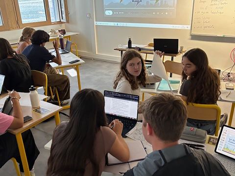 Students learning in classroom abroad