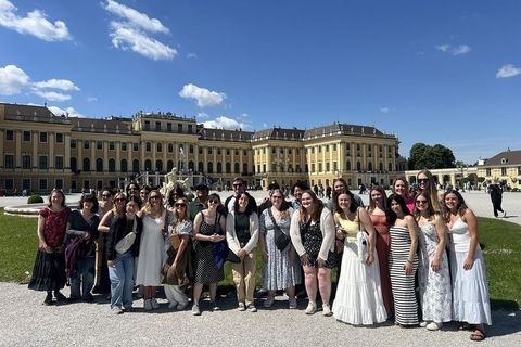Students posing in front of palace in Prague