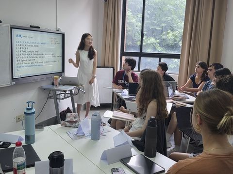 teacher at front of class of students in shanghai 