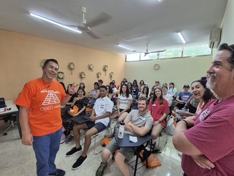 Class of high school students listening to instructors