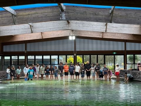 Students standing in front of pool on program in Sydney
