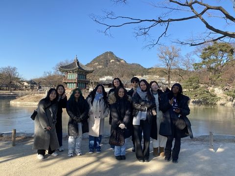 Gap students in Seoul posing in front of temple
