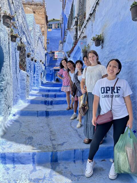 Students on blue staircase in Morocco