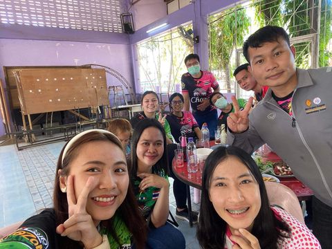 Teachers in Thailand with their students