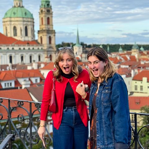 prague-two-girls-smiles-skyline-background