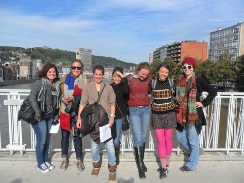 Students pose on bridge during excursion to Liege, Belgium