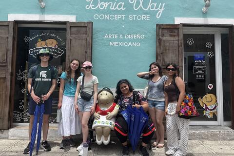 Students outside of a store in Merida