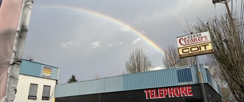 Rainbow behind building