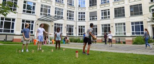 Students playing a game in a courtyard