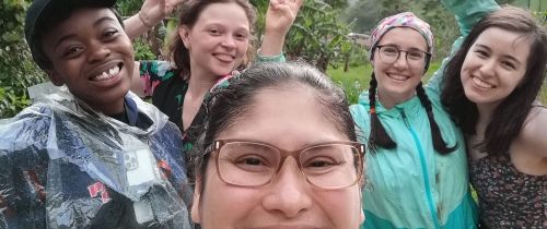 Students taking a group selfie in Monteverde forest