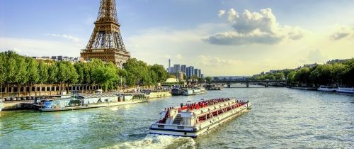 paris tour boat on river near eiffel tower