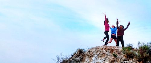 employees jumping on mountain in usa