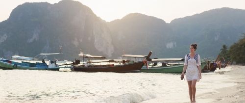 English teacher walking on Thai beach