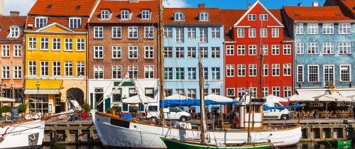 Copenhagen boats in canal by houses
