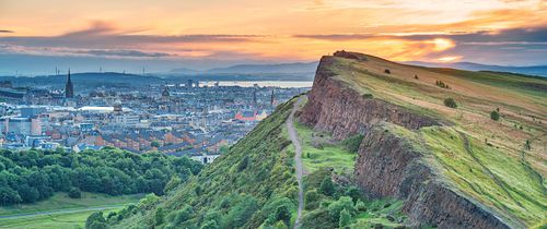 Edinburgh Salisbury Crags in Holyrood Park and downtown Edinburgh