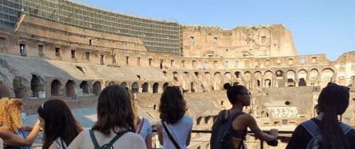 High school students looking out on interior of colosseum in Rome