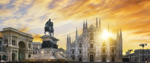 milan city center at sunset statue building