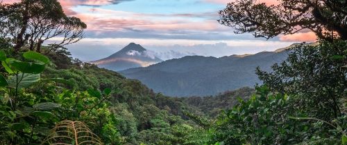 mountains in costa rica with sunset and jungle