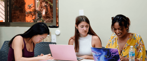 three students on laptops yucatan