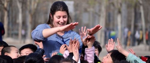 Female teacher with students