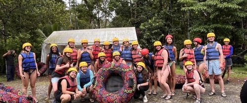 Group of high school students posing before tubing on the Rio Celeste in Monteverde