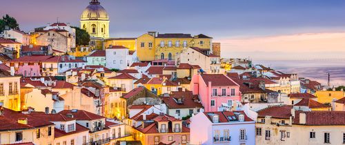 colorful houses along lisbons coast sunset