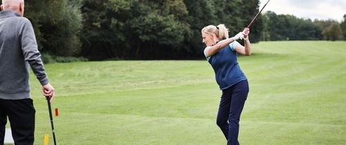 girl golfing in scotland