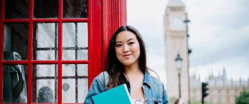 London student standing near phone booth