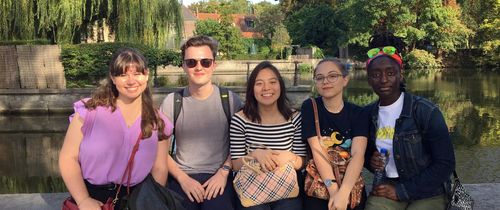 Students by a pond in Brussels