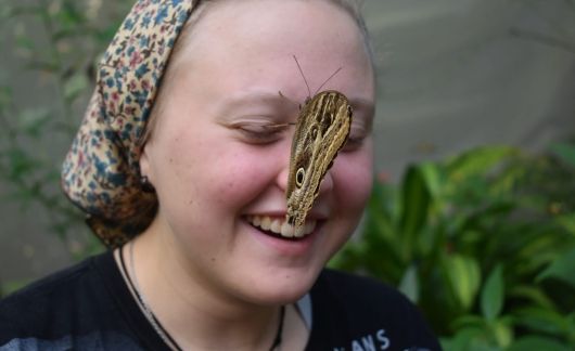 Butterfly on high school student's face