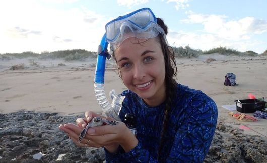 study abroad student snorkeling