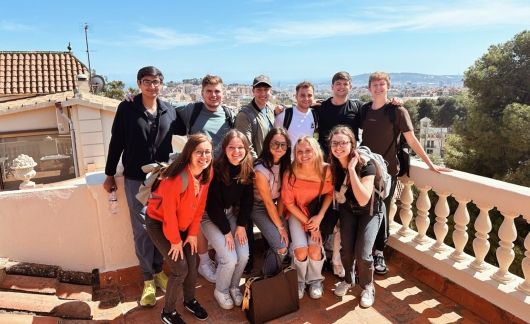 fall study abroad student group at top of barcelona hill