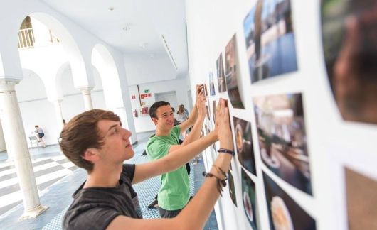 seville photo wall study abroad students hanging photos