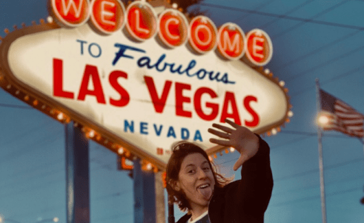employee in vegas by sign
